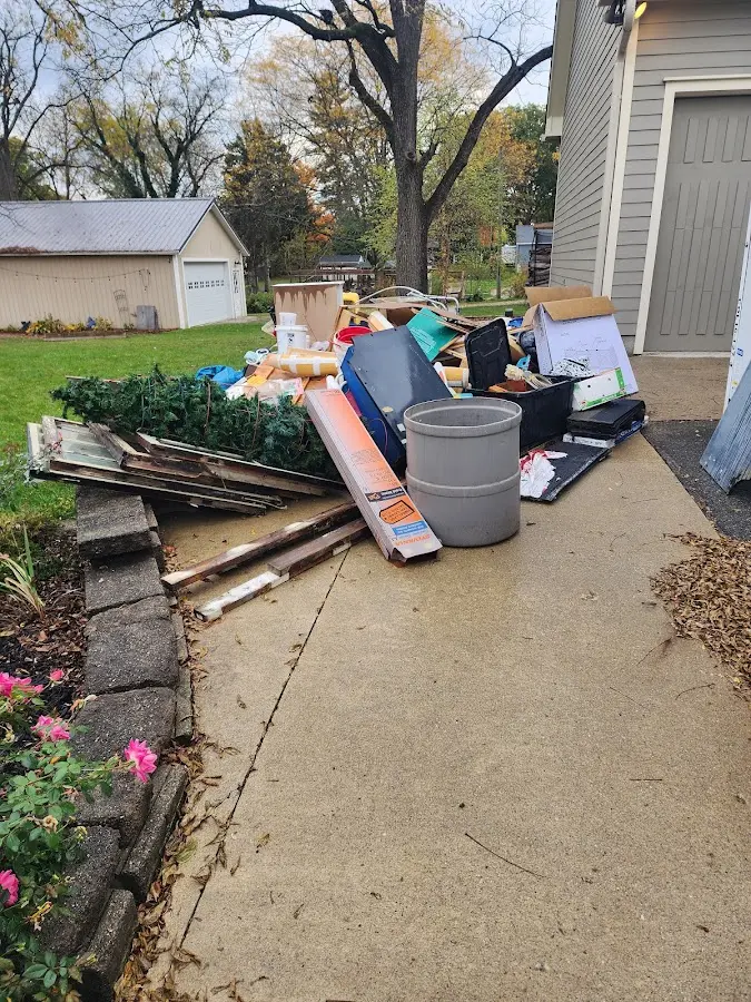 Dumpster being loaded with debris for Residential Dumpster Rental in Elk Ridge